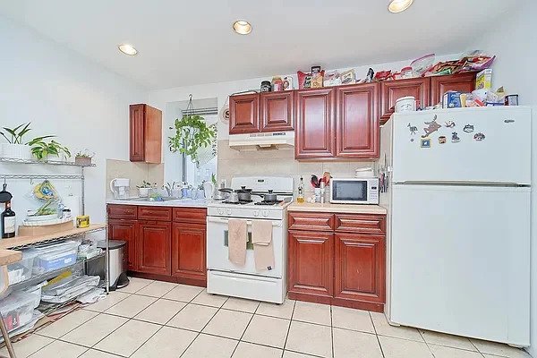 Kitchne with cabinets and window