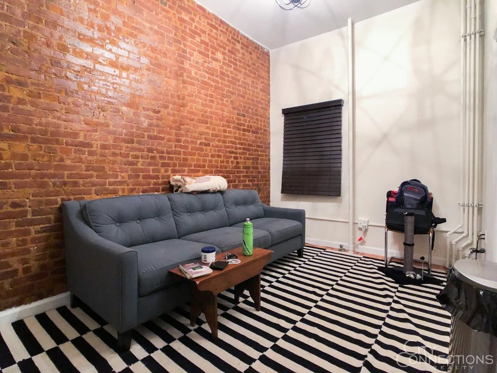 Living room with exposed brick