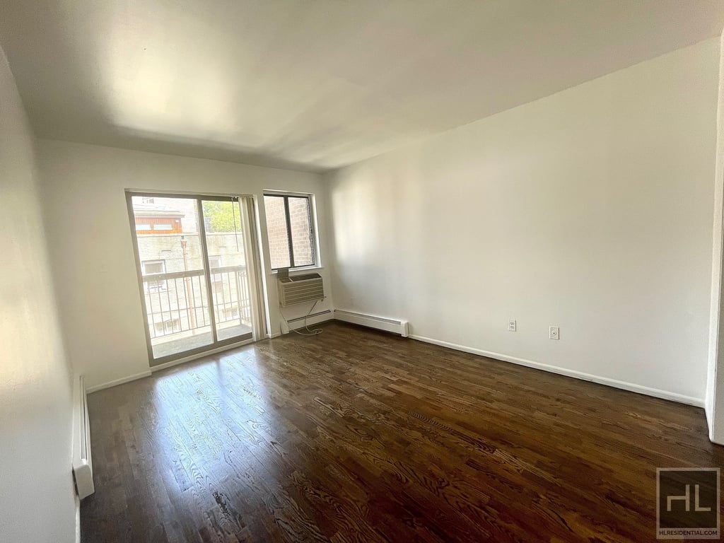 Large living space with dark hardwood floors