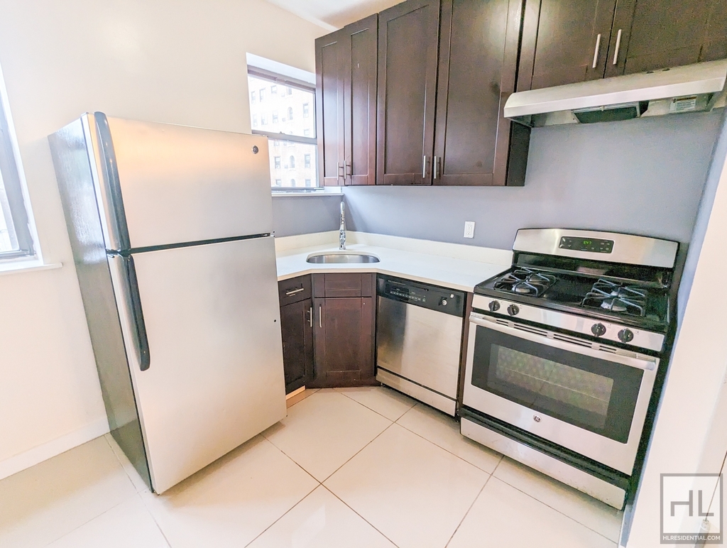 Kitchen with stainless steel appliances in Brooklyn